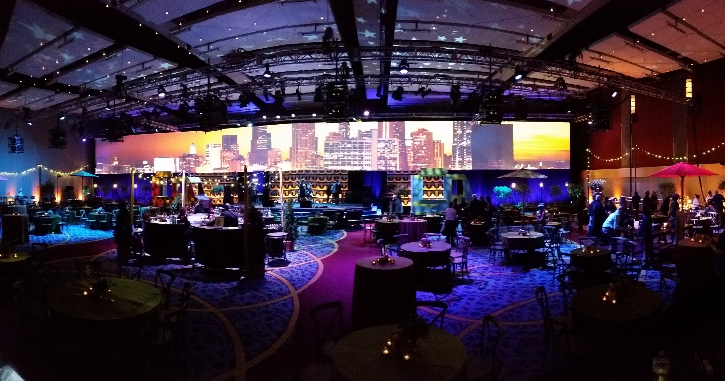 A cocktail event with super widescreen and custom scenic elements.